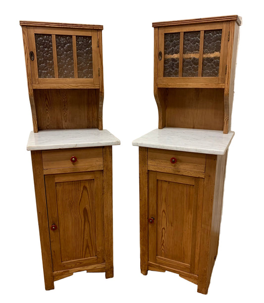 A Pair of Marble Topped Cabinets