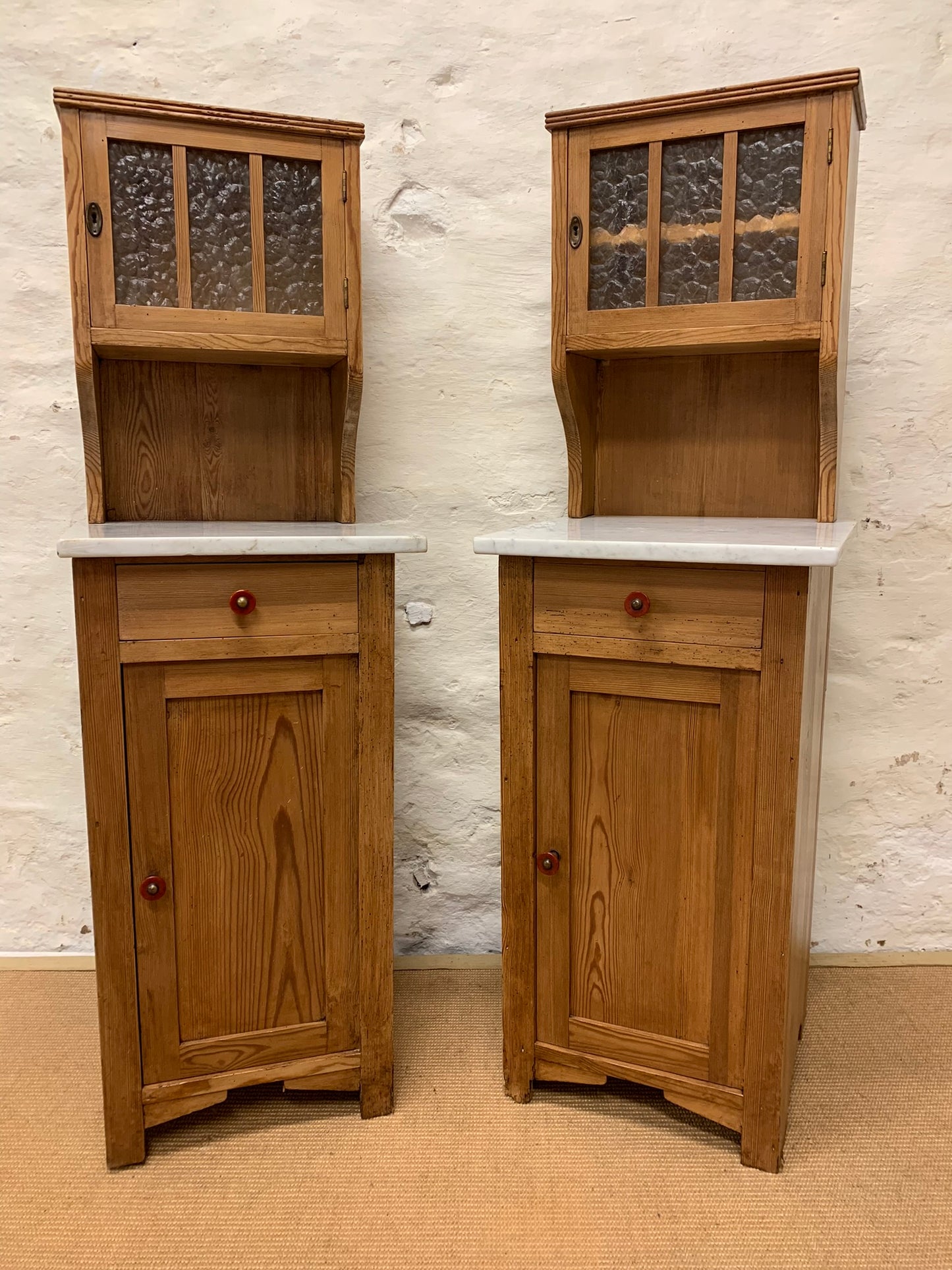 A Pair of Marble Topped Cabinets