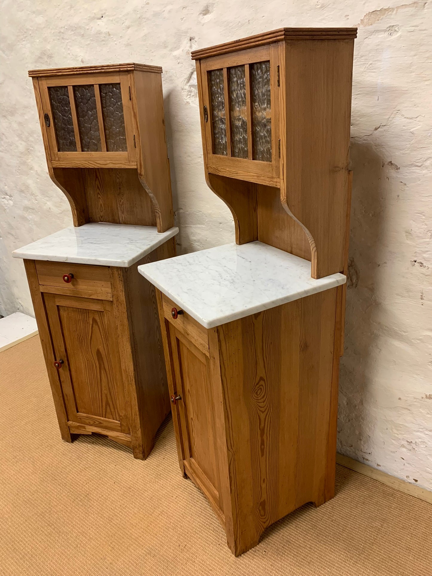 A Pair of Marble Topped Cabinets