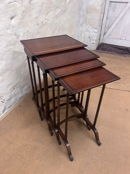 Nest of 4 Mahogany Tables