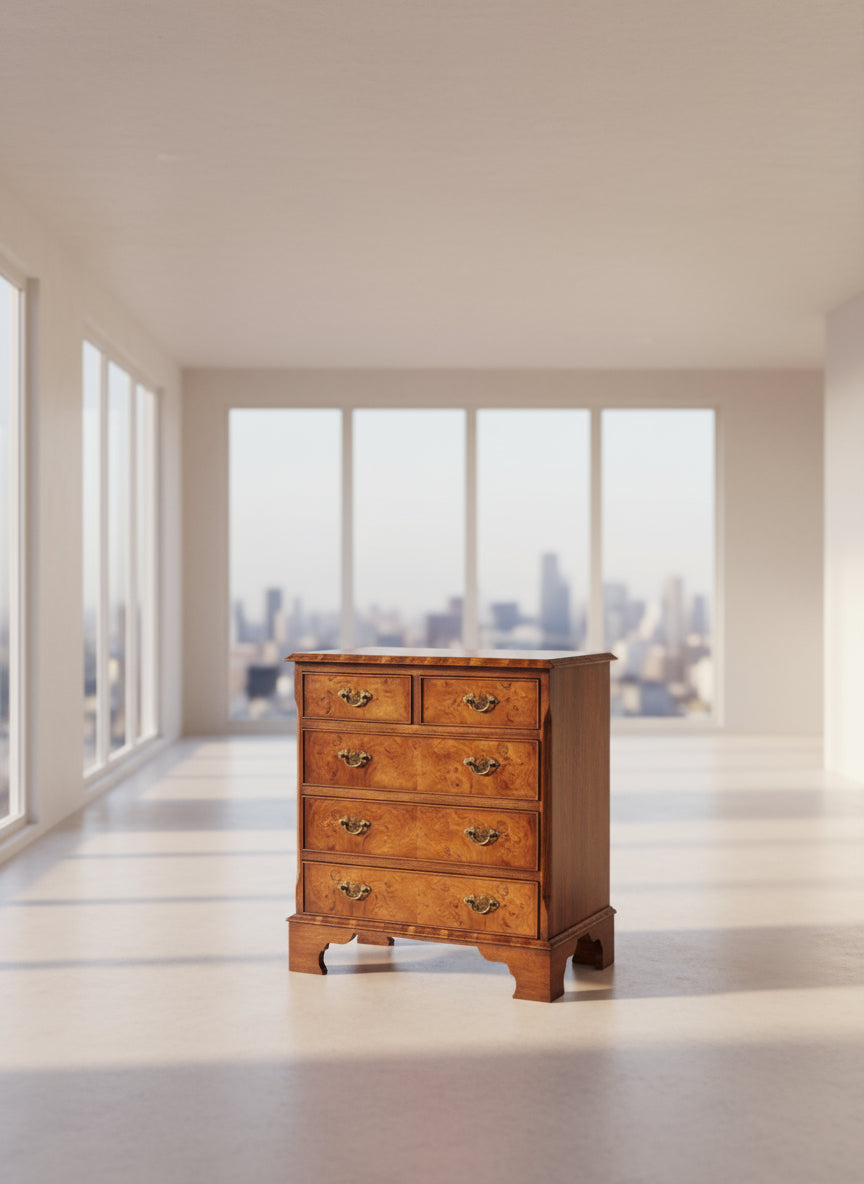 Wooden dresser with four drawers on a plain background