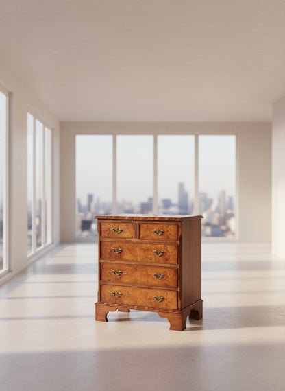 Wooden dresser with four drawers on a plain background